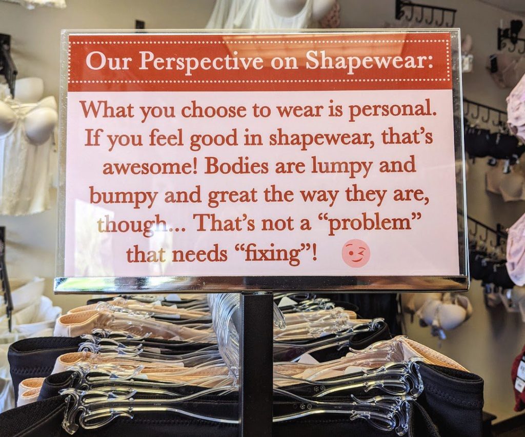 A sign explaining Grail's approach to shapewear